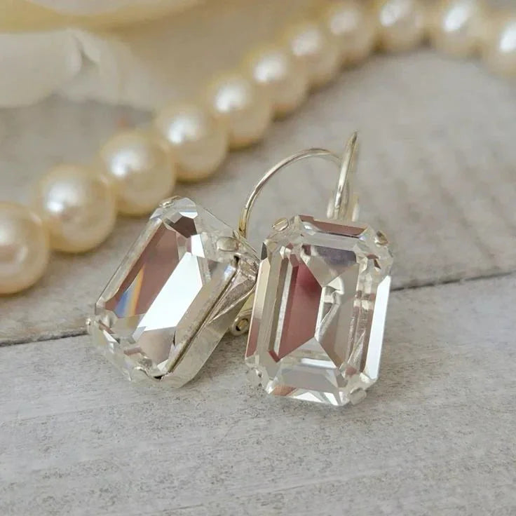 Elegant vintage earrings with large, clear rectangular crystals