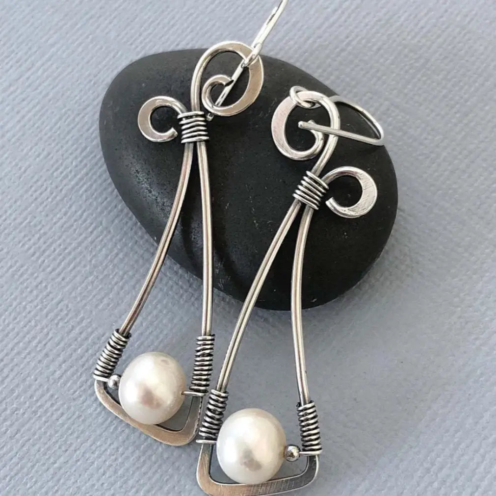 Vintage-style pearl earrings with a wrapped wire detail
