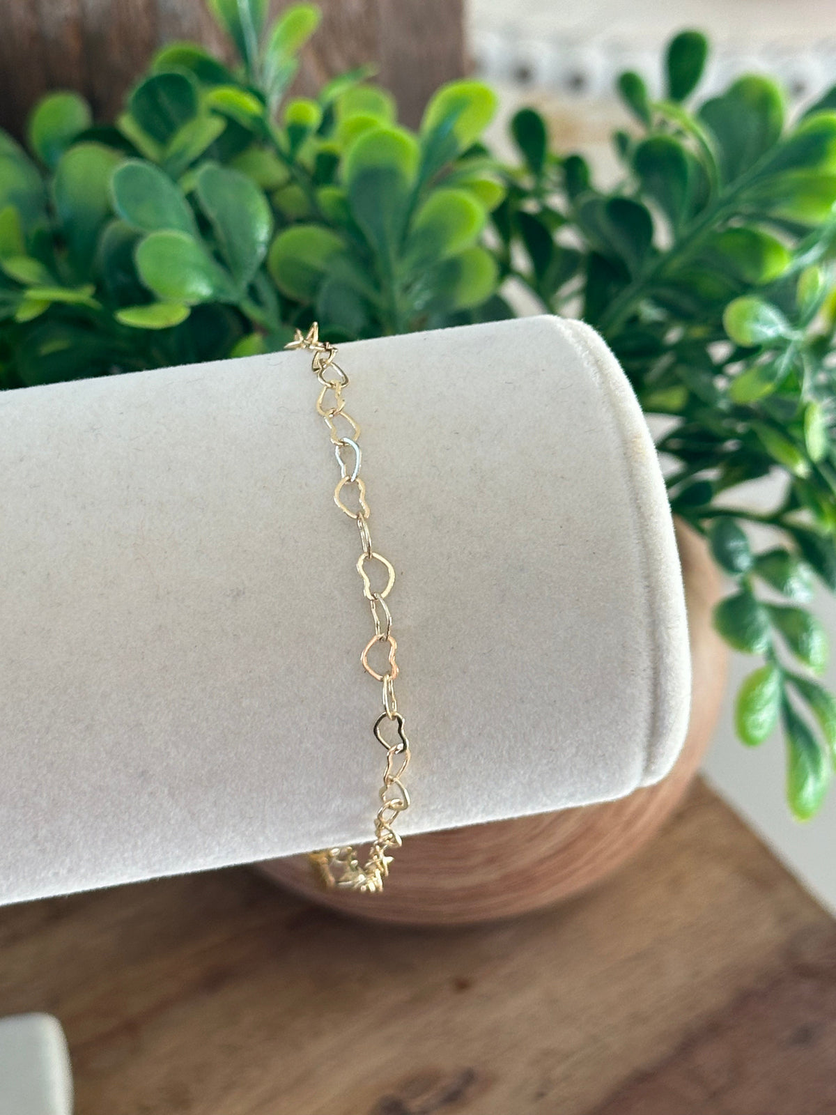 Filigree heart-link bracelet with a delicate key pendant