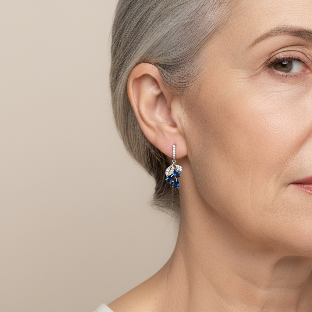 Elegant earrings with blue teardrop-shaped crystals and sparkling cubic zirconia stones