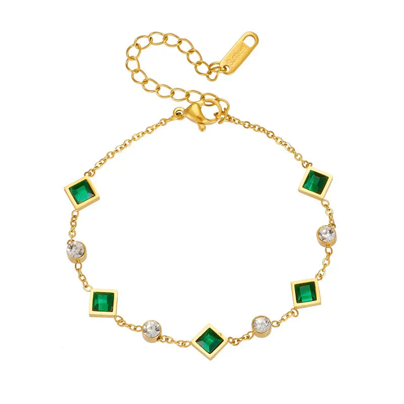 An elegant bracelet featuring square emerald stones and cubic zirconia