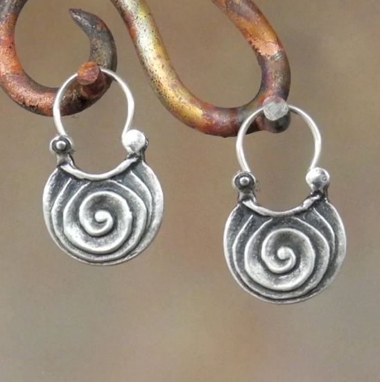 Antique ethnic spiral earrings with ornate Celtic motifs