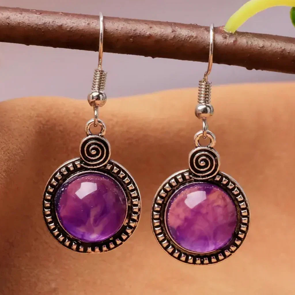 Vintage earrings with purple crystal and spiral detailing