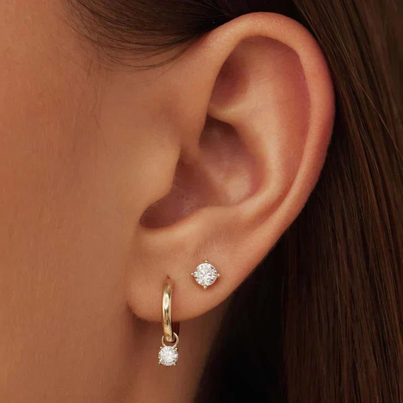 Earrings featuring sparkling cubic zirconia stones in a classic pointed setting