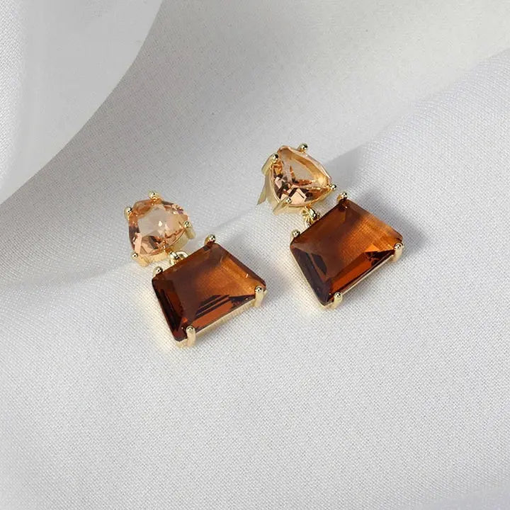 Elegant earrings featuring desert crystals and brown stones