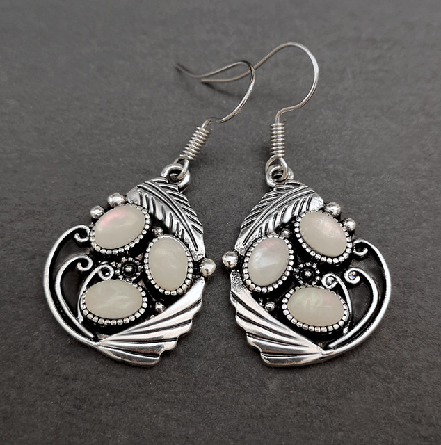 Vintage-inspired earrings with opal stones and delicate detailing