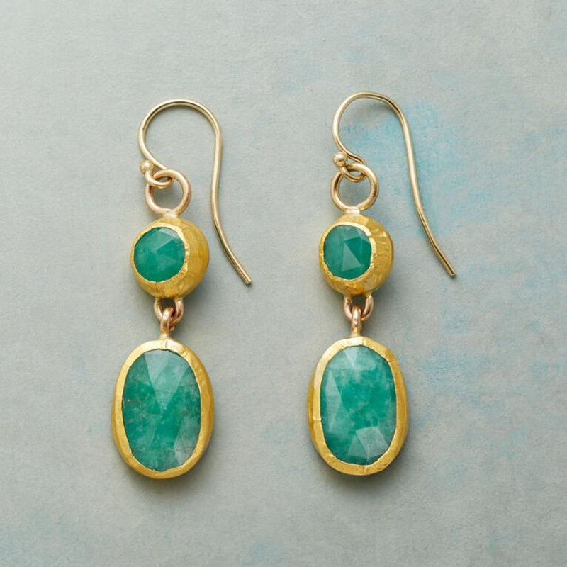 Elegant earrings featuring faceted turquoise gemstones set in gold