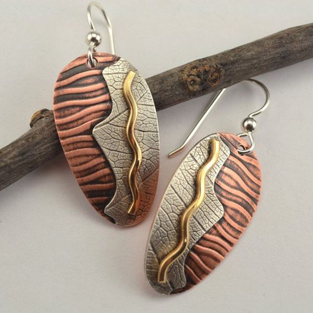 Vintage copper leaf earrings with a wave pattern and nature-inspired design