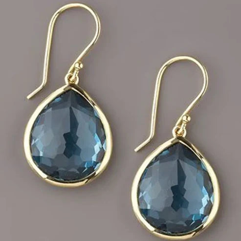 Elegant women’s earrings with blue teardrop-shaped crystals