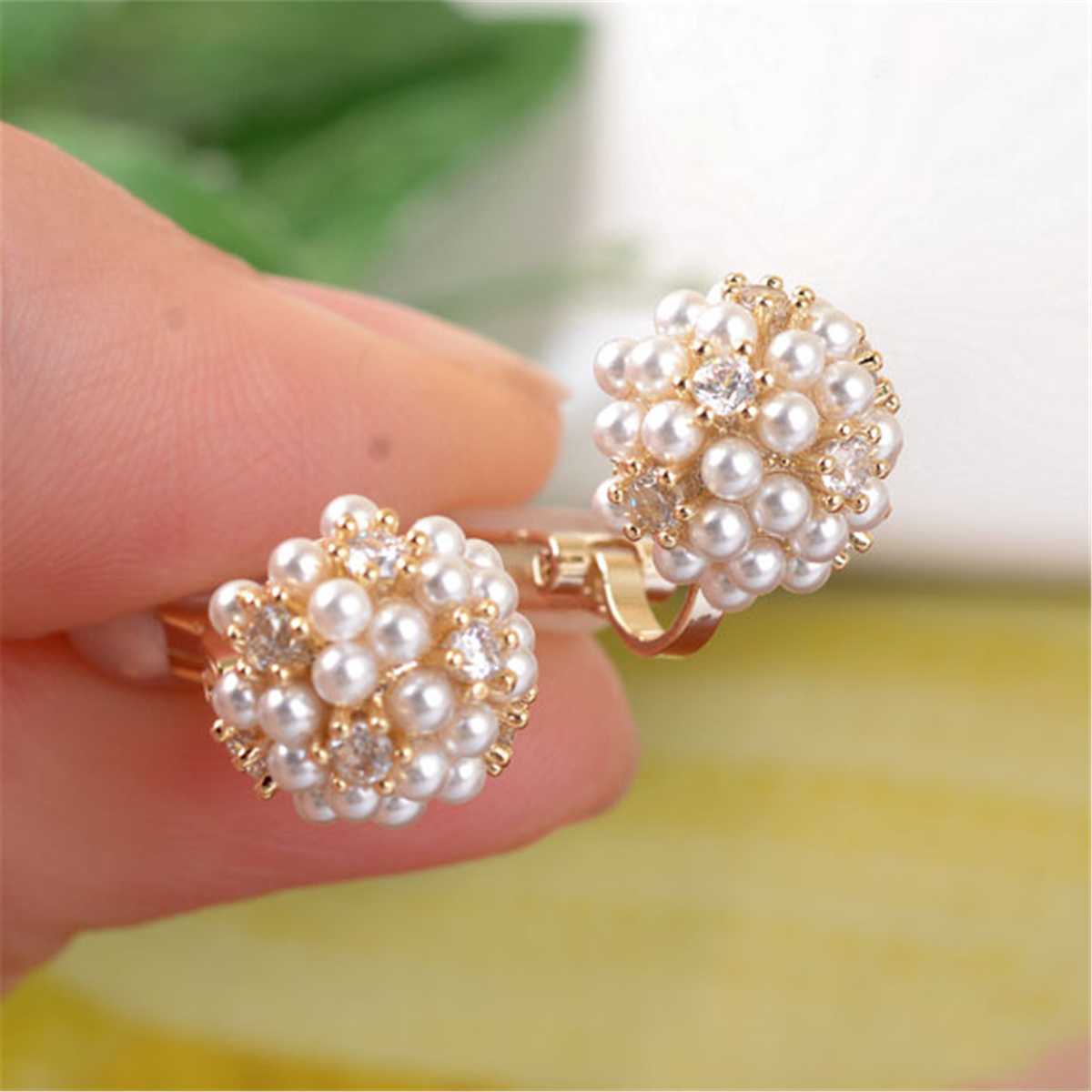 Elegant earrings featuring delicate pearls and sparkling cubic zirconia stones