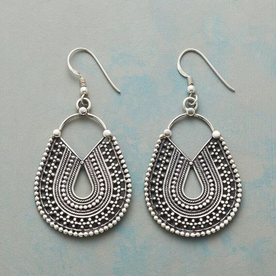 Delicate vintage teardrop-shaped earrings with an ethnic mandala design