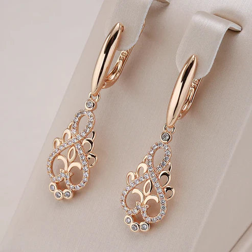 Elegant rose gold-coloured earrings with sparkling cubic zirconia, perfect for festive occasions