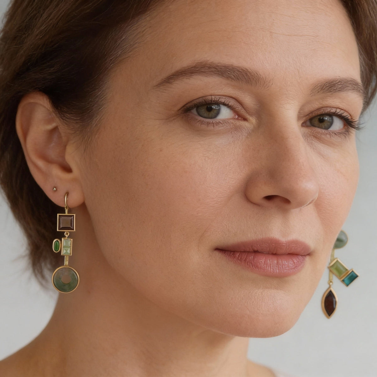 Vintage asymmetrical earrings featuring green agate and smoky quartz