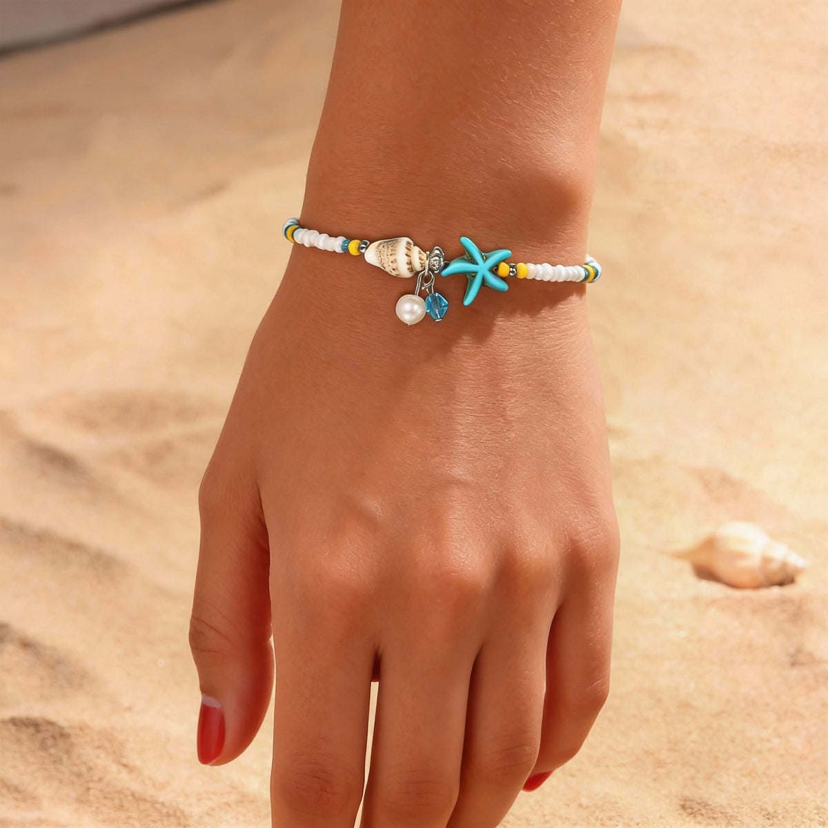 Beaded beach anklet with a starfish shell and pendants