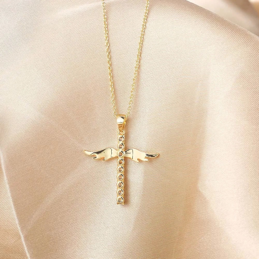 Elegantly Curved Winged Cross Necklace with Sparkling Details
