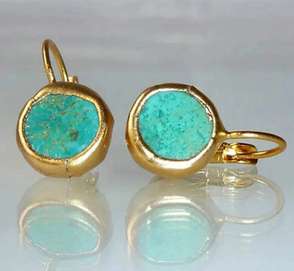Vintage-style turquoise earrings with an elegant gold setting