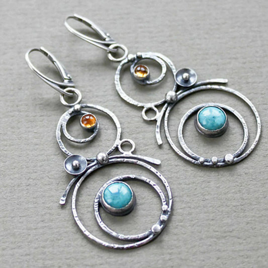 Handmade spiral earrings with turquoise and amber details