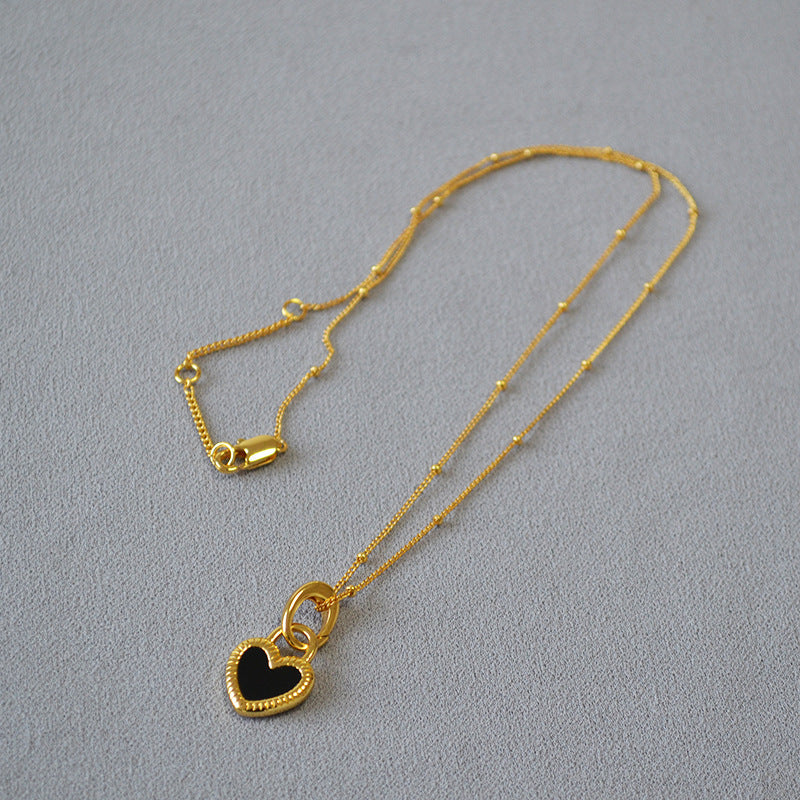 Gold Necklace with Black and White Heart Pendant