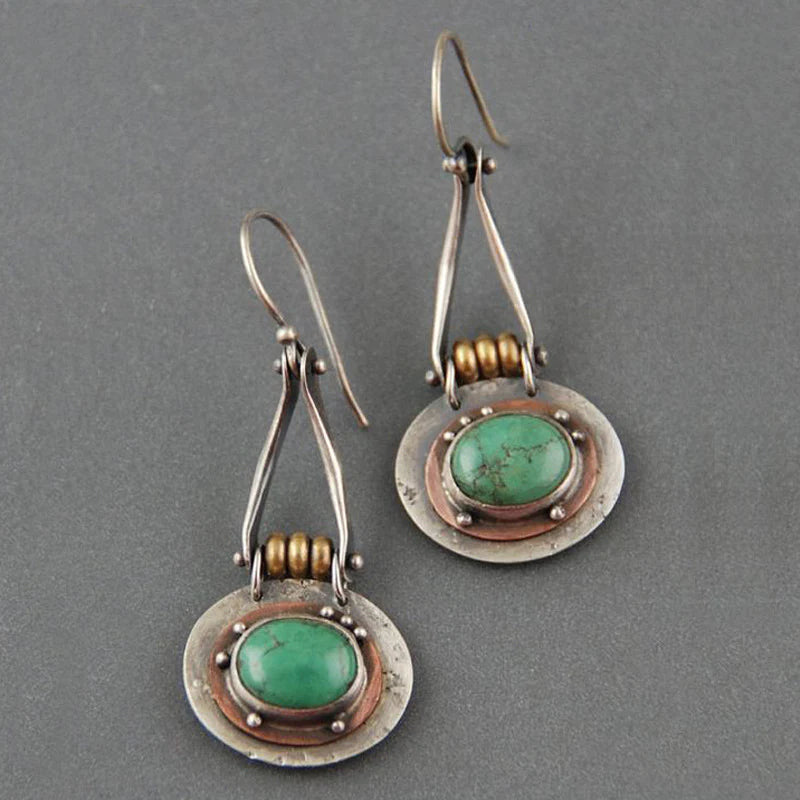 Turquoise earrings with copper detailing and a tribal design