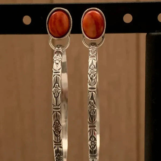 Elegant earrings with interchangeable stones and a floral design