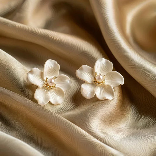 Elegant flower-shaped earrings with delicate pearls and sparkling details