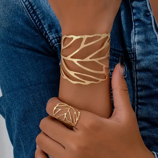 A modern bracelet and ring set featuring a leaf design