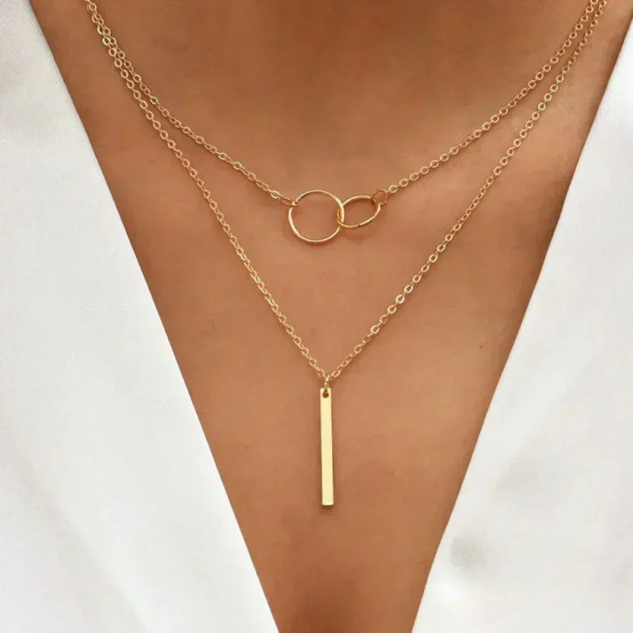 Multi-Strand Necklace with Rings and Elegant Bar Pendant