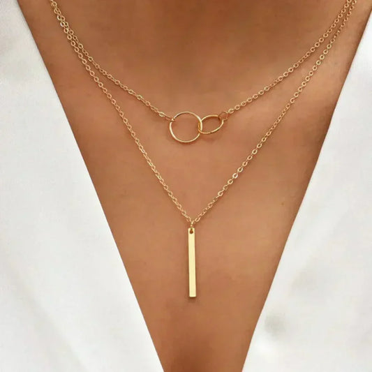 Multi-Strand Necklace with Rings and Elegant Bar Pendant
