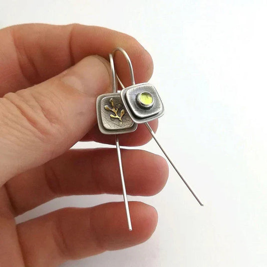 Long earrings with a square design and leaf motifs
