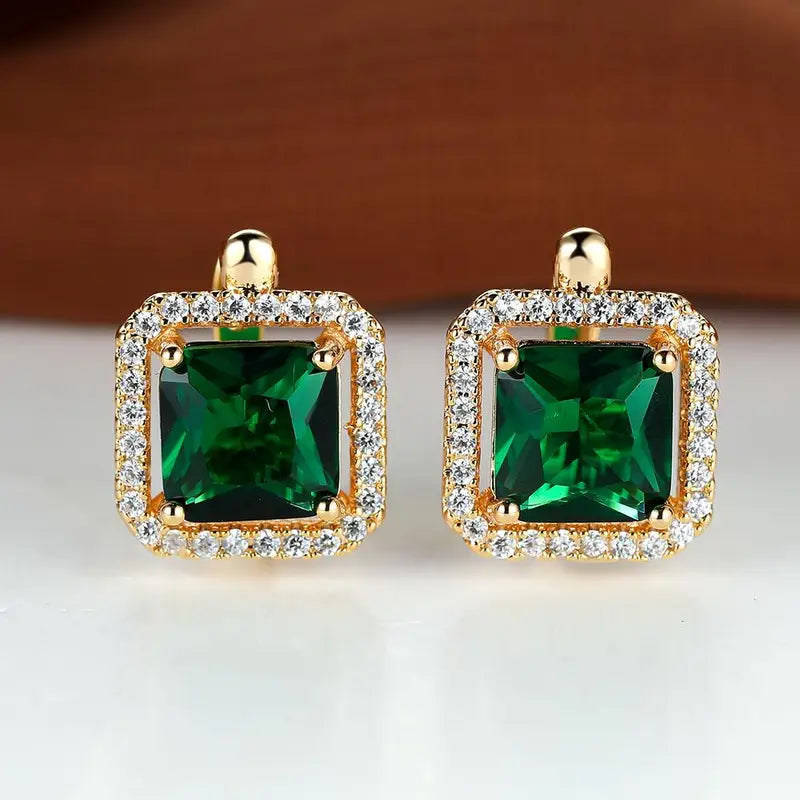 Glamorous earrings with square green cubic zirconia and a rhinestone crown