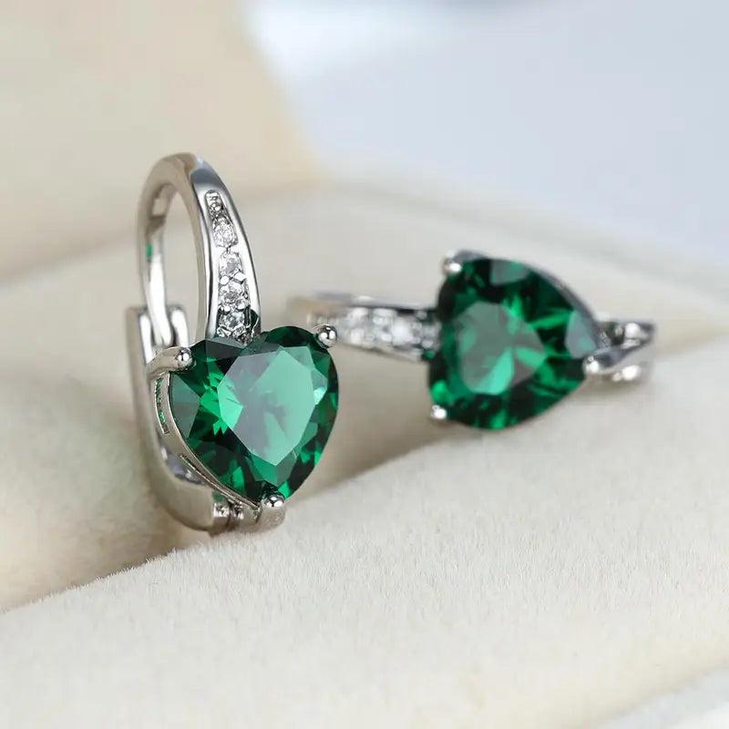 Elegant heart-shaped earrings with emerald-green cubic zirconia stones