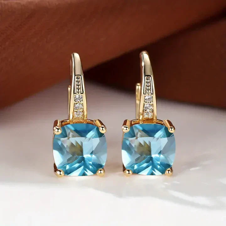 Sparkling hoop earrings with cushion-cut cubic zirconia