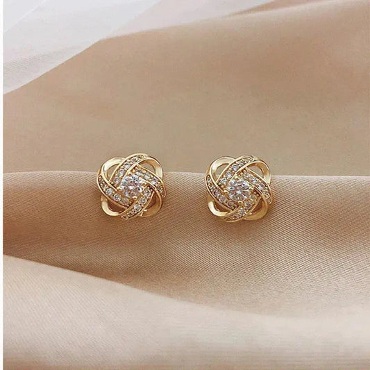 Brilliant Spiral Earrings with Flower Cross Design and Cubic Zirconia