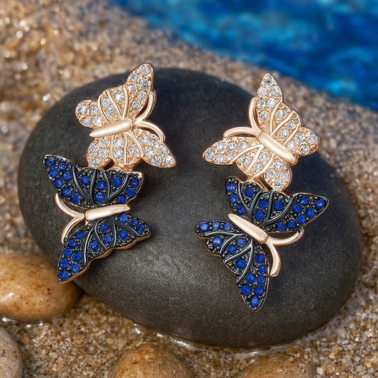 Sparkling butterfly earrings set with pavé sapphires and diamonds