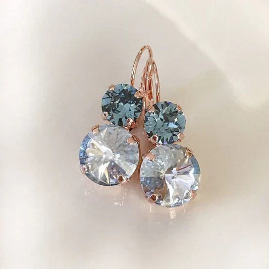Rose gold earrings with sparkling blue and clear crystal stones