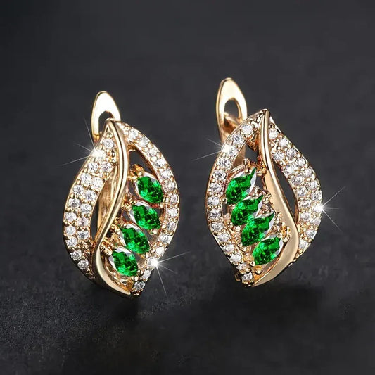Earrings featuring leaf-shaped, sparkling green cubic zirconia stones, embellished with sparkling stones
