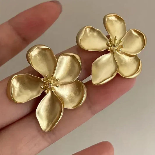 Floral earrings with delicate petals and a sparkling centre
