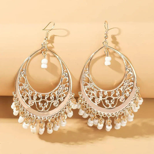 Oriental earrings with filigree motifs and white pearls