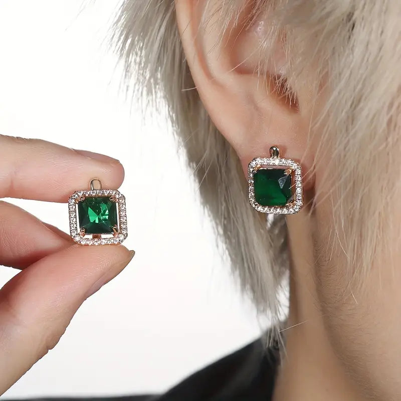 Glamorous earrings with square green cubic zirconia and a rhinestone crown