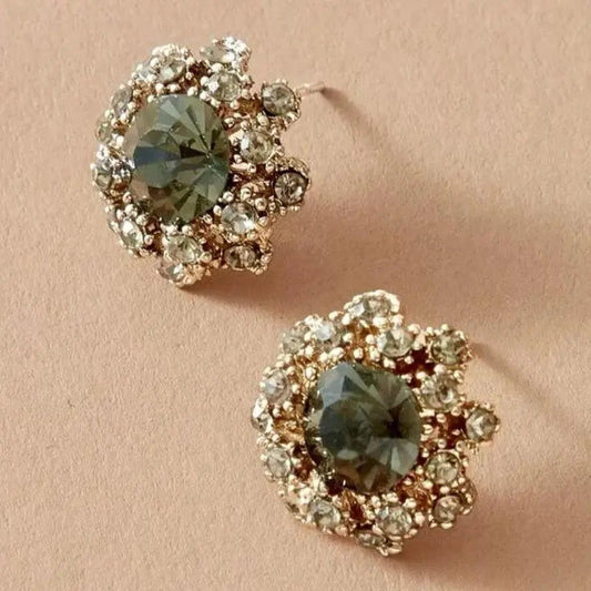 Elegant earrings with green glass and sparkling gemstone detailing