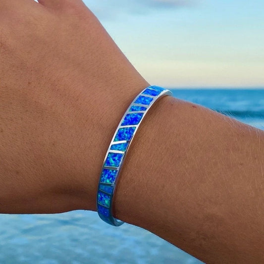 Bracelet featuring brilliant blue opal inlays in a striped design
