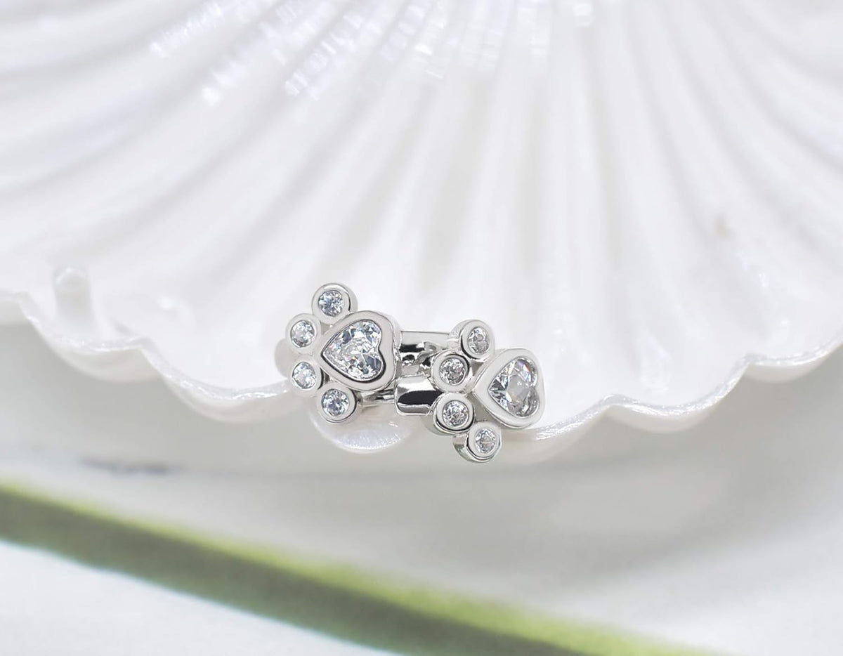 Hoop earrings featuring a paw print and sparkling cubic zirconia, for animal lovers