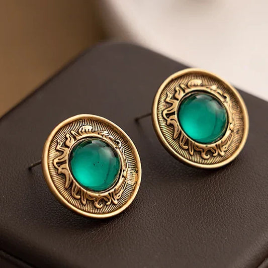 Vintage emerald-green crystal earrings with an antique finish