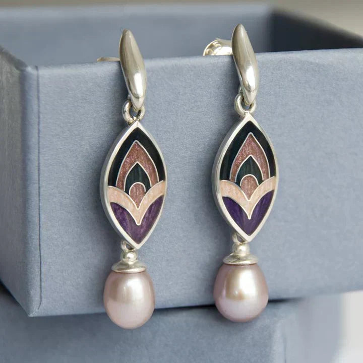 Elegant enamel earrings with a playful pattern and pink beads