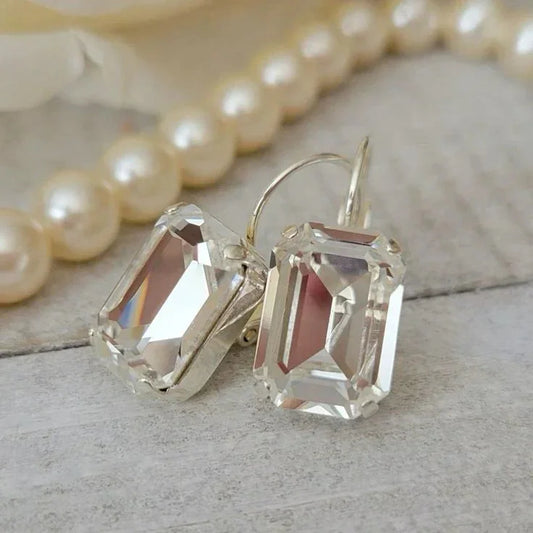Elegant vintage earrings with large, clear rectangular crystals