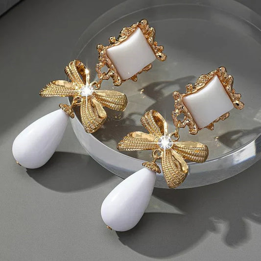 Elegant Vintage Earrings with White Stone and Bow Dangle