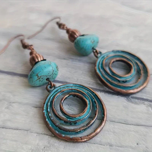 Boho-style copper spiral earrings with genuine turquoise stones