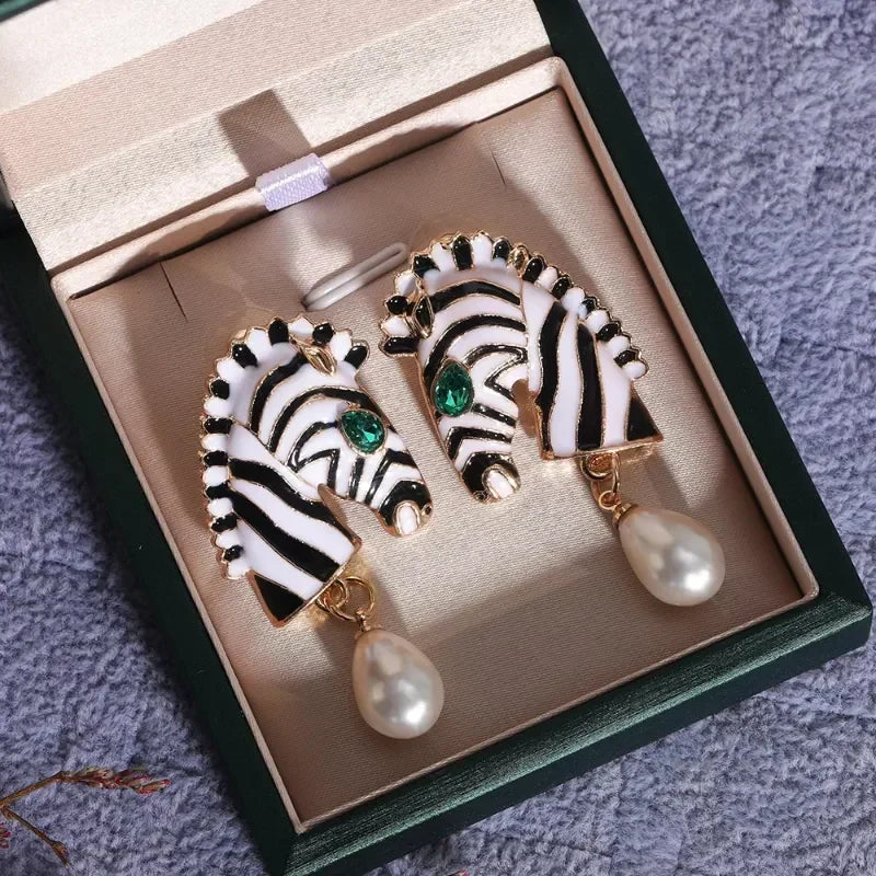 Elegant zebra-print earrings with green cubic zirconia and freshwater pearls