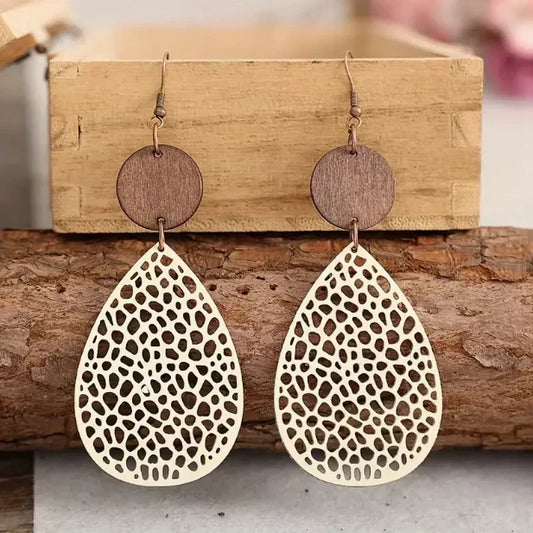Elegant teardrop-shaped wooden earrings with a pattern of holes