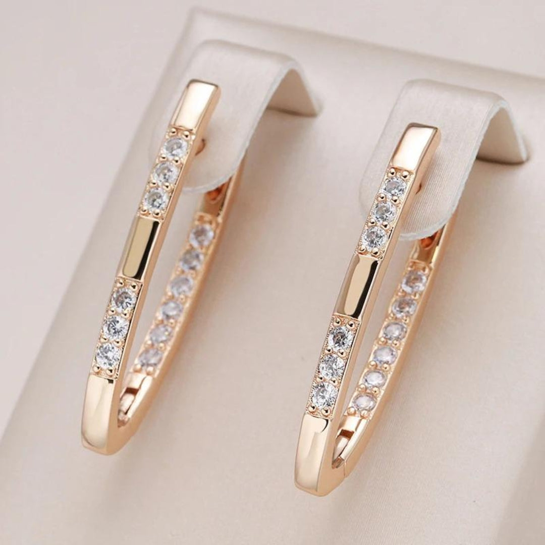 Shiny oval hoop earrings with cubic zirconia and an elegant design